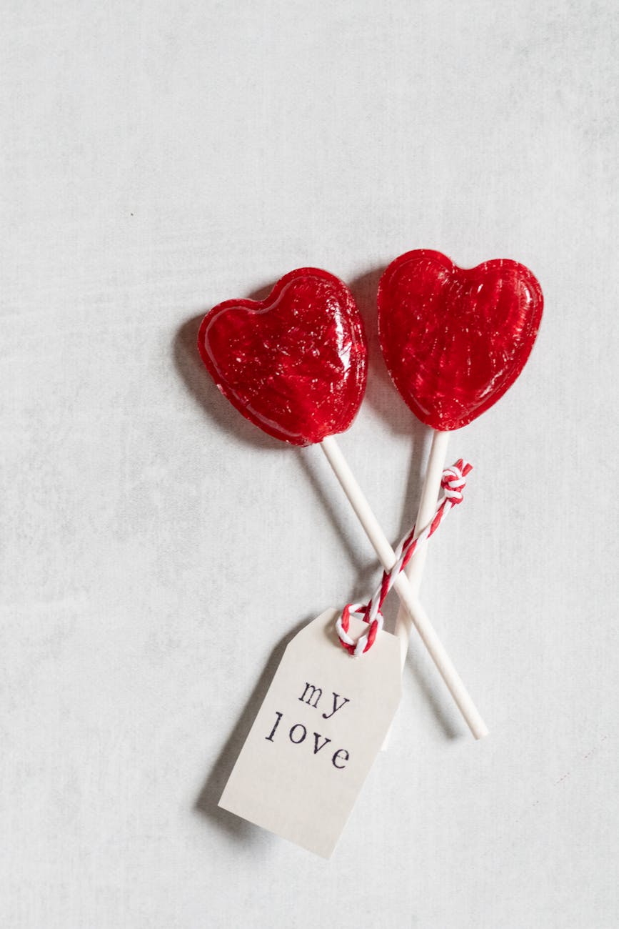 two lollipops with a tag that says love you