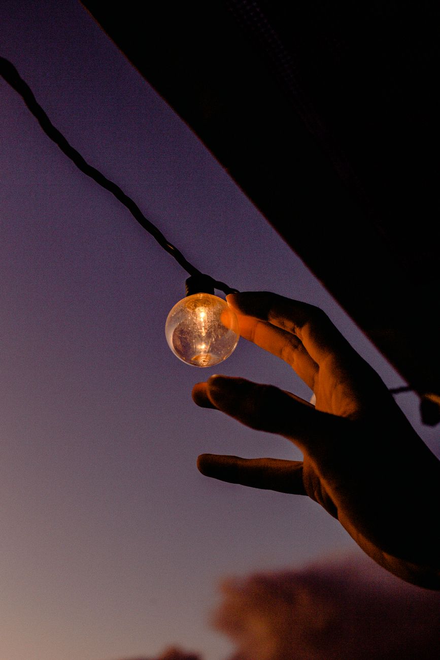 person reaching led light
