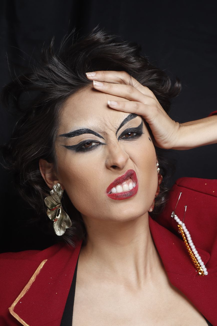 expressive woman showing emotions with bold makeup